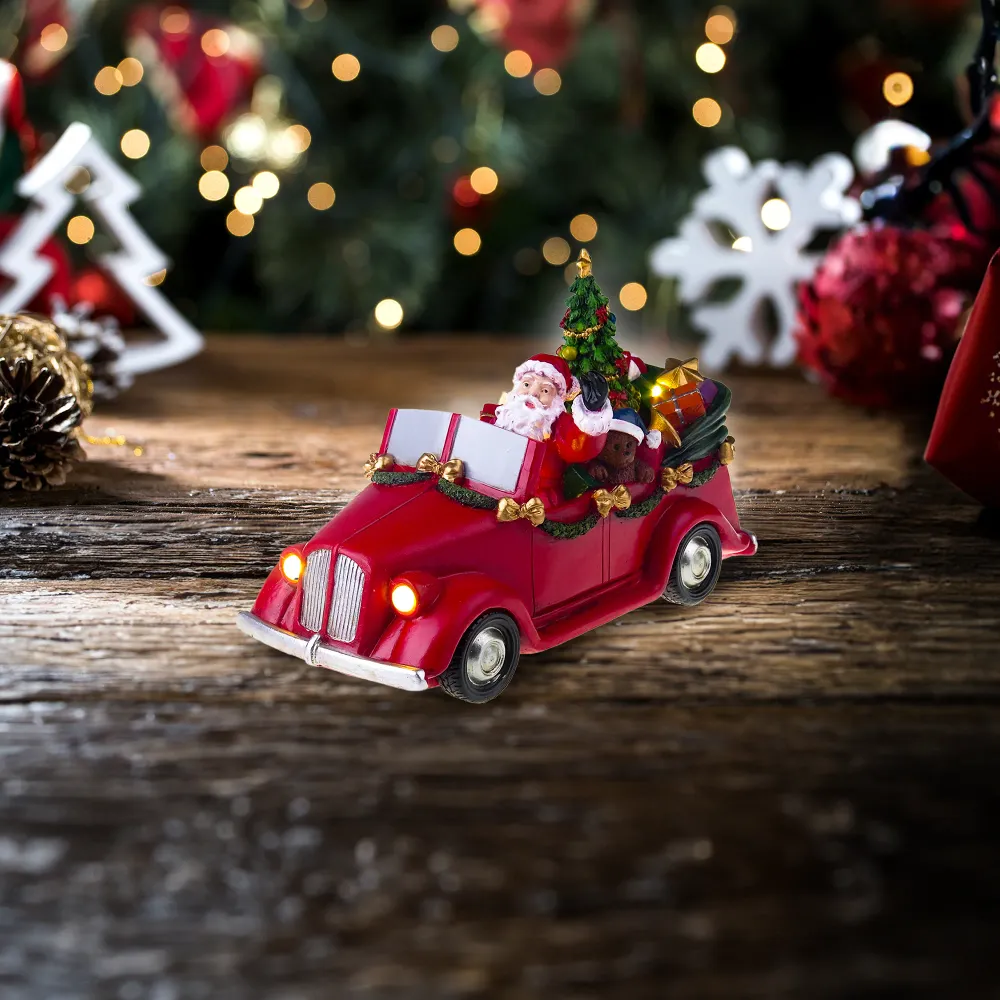Julemanden i bil med drejende træ