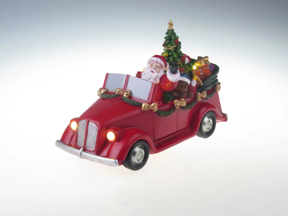 Julemanden i bil med drejende træ